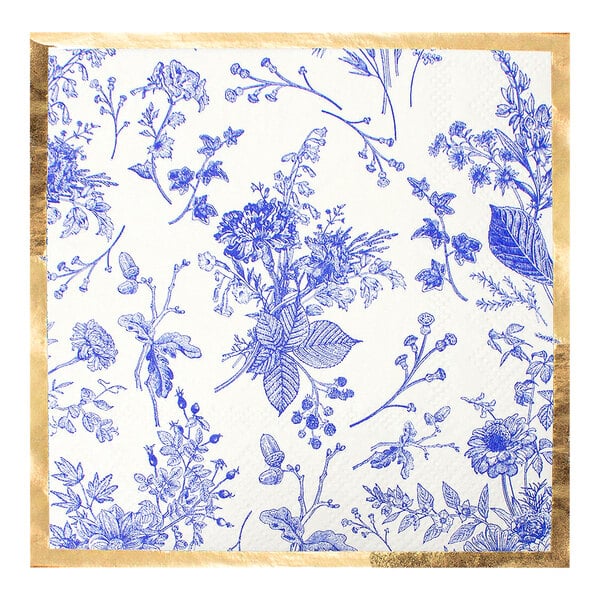 A white napkin with a blue floral pattern and gold trim.