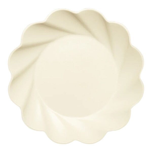 A white Sophistiplate Simply Eco dinner plate with a scalloped edge.