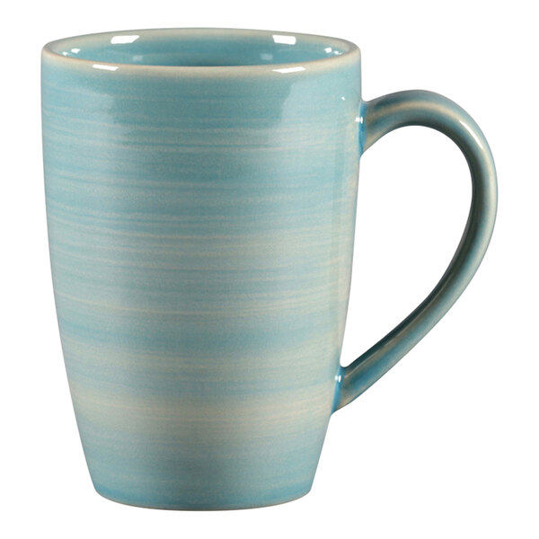 A close-up of a blue and white RAK Porcelain mug with a handle.