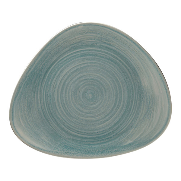 A close-up of a blue RAK Porcelain plate with a spiral pattern.
