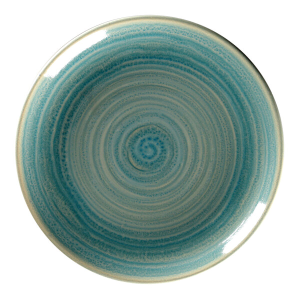 A blue porcelain plate with a white spiral design.