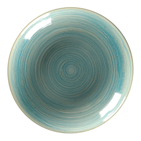 A close-up of a RAK Porcelain deep coupe plate with a blue and white swirly pattern.
