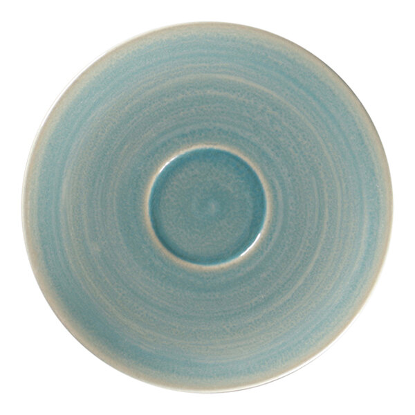 A close-up of a blue RAK Porcelain espresso cup saucer with a white spot in the middle.