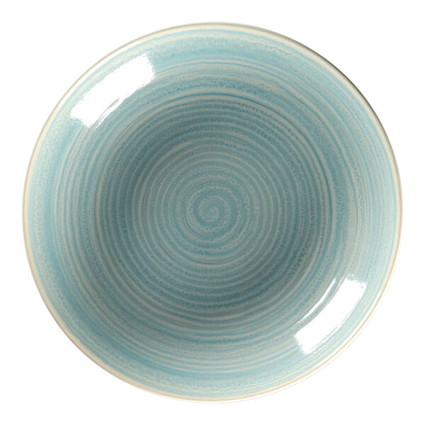 A close-up of a RAK Porcelain blue and white spiral pattern on a plate.