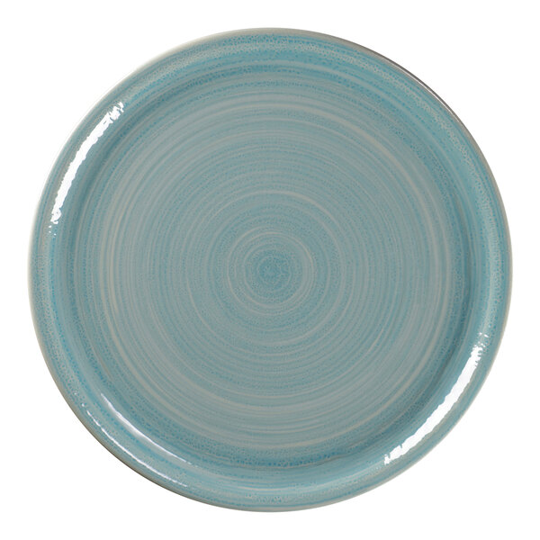 A close-up of a blue RAK Porcelain pizza plate with a circular and spiral design in white.