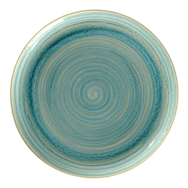 A close-up of a blue and white spiral design on a RAK Porcelain coupe plate.