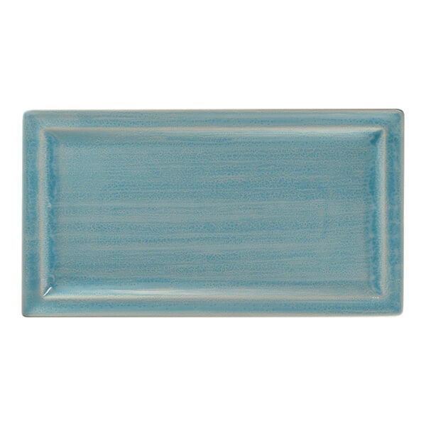 A rectangular sapphire porcelain tray with a white background and blue striped surface.