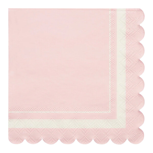A pink napkin with scalloped edges and a white border.