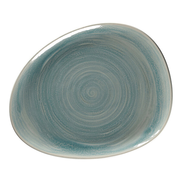 A close-up of a RAK Porcelain Sapphire blue flat organic plate with a spiral design.