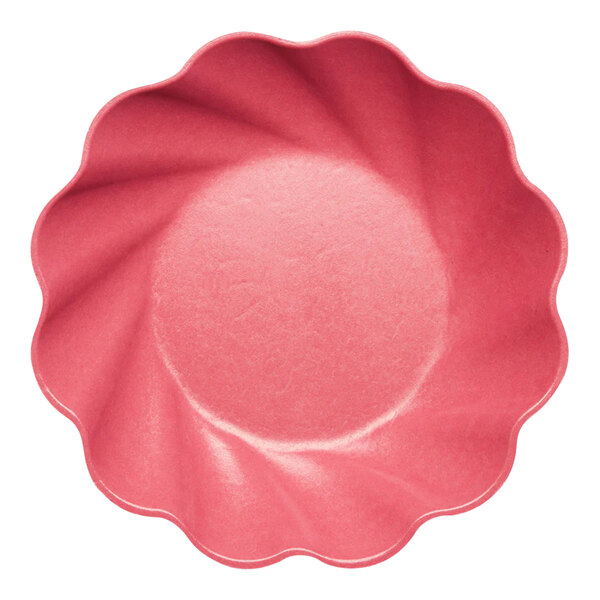 A pink Sophistiplate salad plate with a scalloped edge.