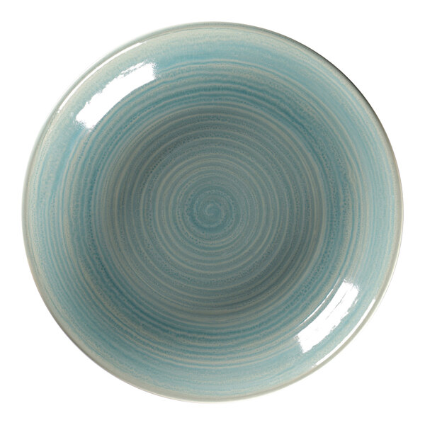 A close-up of a RAK Porcelain Sapphire deep coupe plate with a blue and white spiral design.