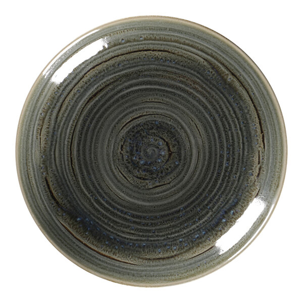 A close-up of a RAK Porcelain deep coupe plate with a blue and black spiral design on a white background.