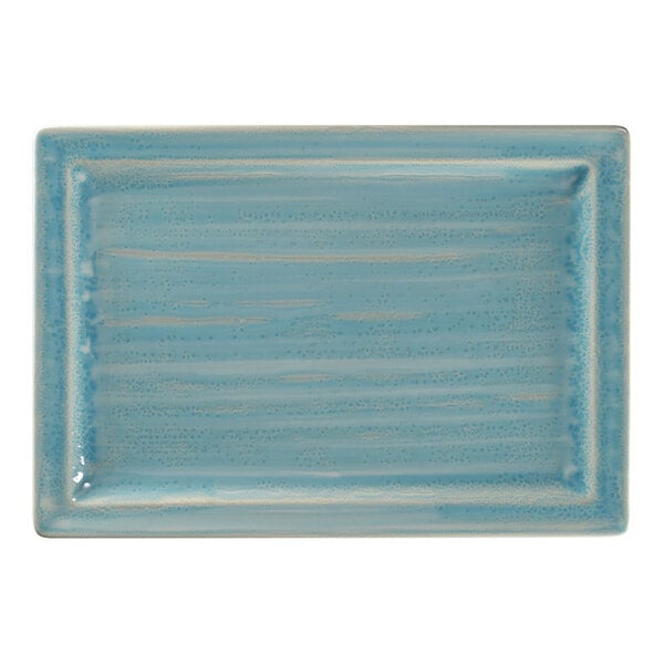 A blue rectangular porcelain tray with speckled texture.