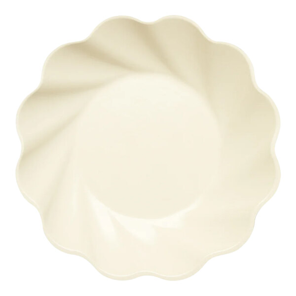 A white Sophistiplate salad plate with a scalloped edge.