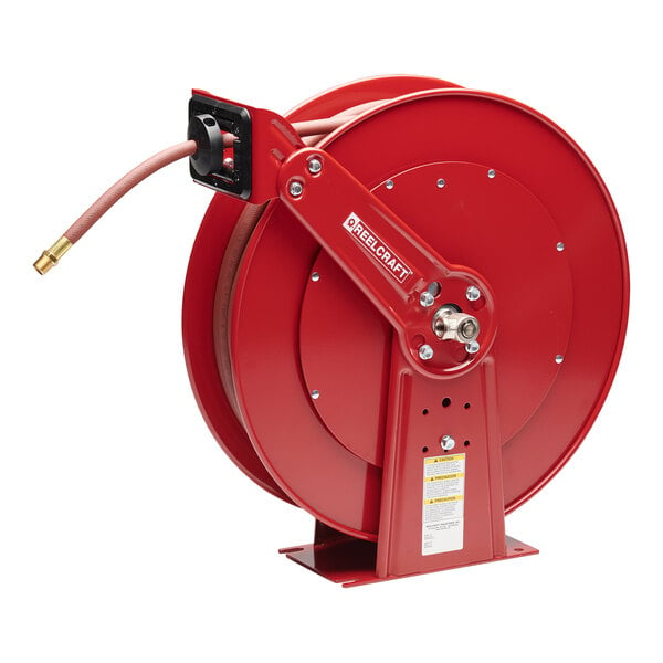 A red Reelcraft dual pedestal hose reel with a hose attached.