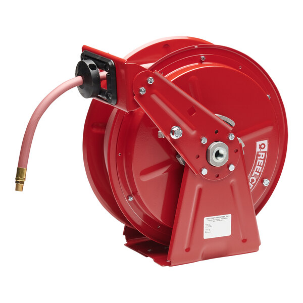 A red Reelcraft hose reel with a hose attached.
