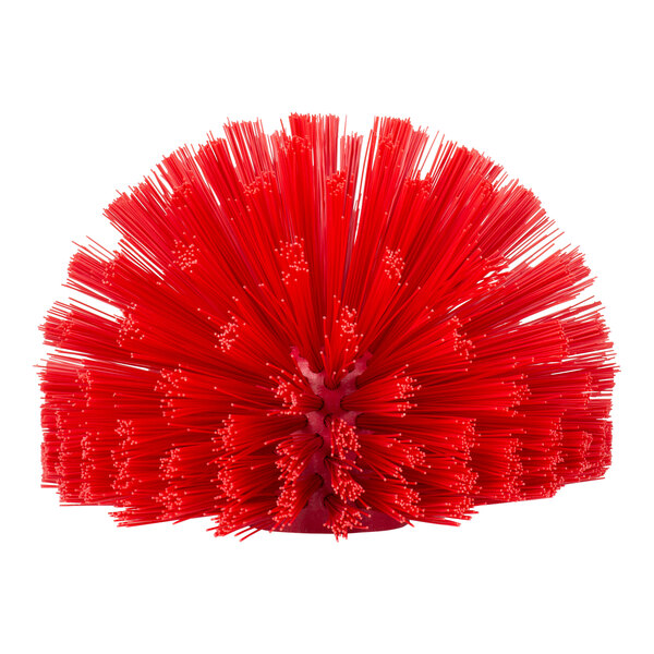 A red round Carlisle Sparta brush with long sticks and long bristles.