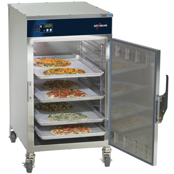 An Alto-Shaam Low Temperature Holding Cabinet with several trays of food inside.