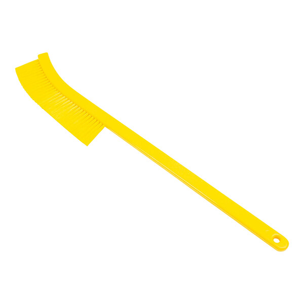 A yellow plastic brush with long bristles.