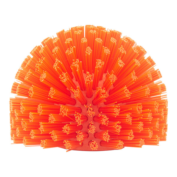 A round orange Carlisle Sparta brush with many bristles.
