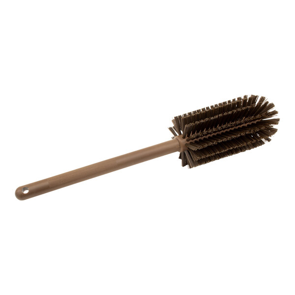 A Carlisle brown bottle cleaning brush with bristles and a wooden handle.