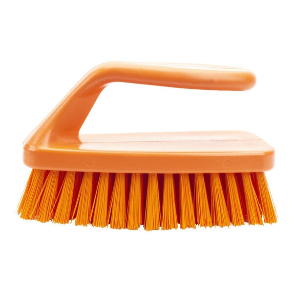 An orange Carlisle Sparta hand scrub brush with a handle.