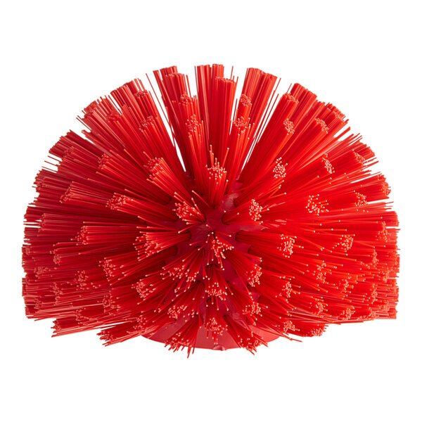 A red plastic Carlisle Sparta brush with long bristles and a handle.