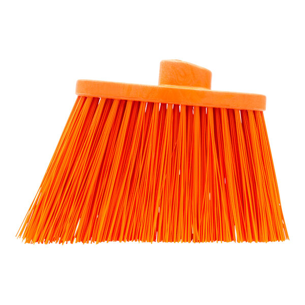An orange Carlisle heavy-duty broom head with unflagged bristles.