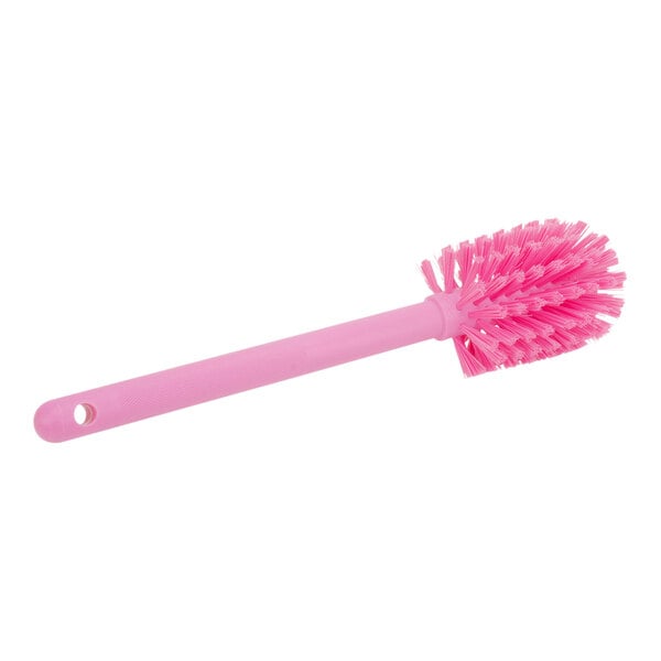 A pink Carlisle Sparta bottle cleaning brush with a handle.