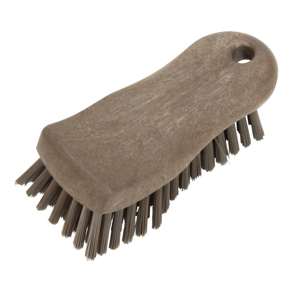 A Carlisle brown handheld scrub brush with bristles.