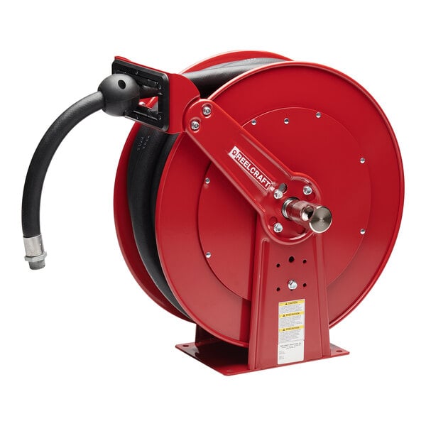 A red Reelcraft fuel hose reel with a hose attached.