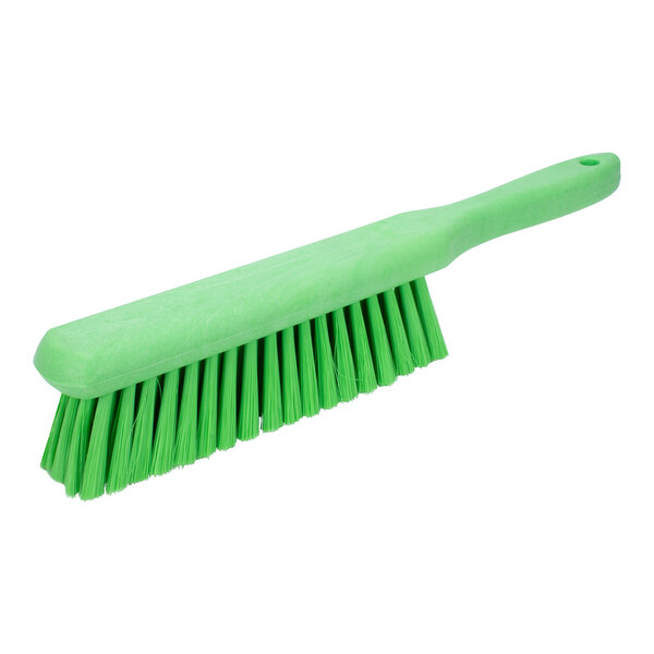 A green Carlisle Sparta counter brush with white bristles.