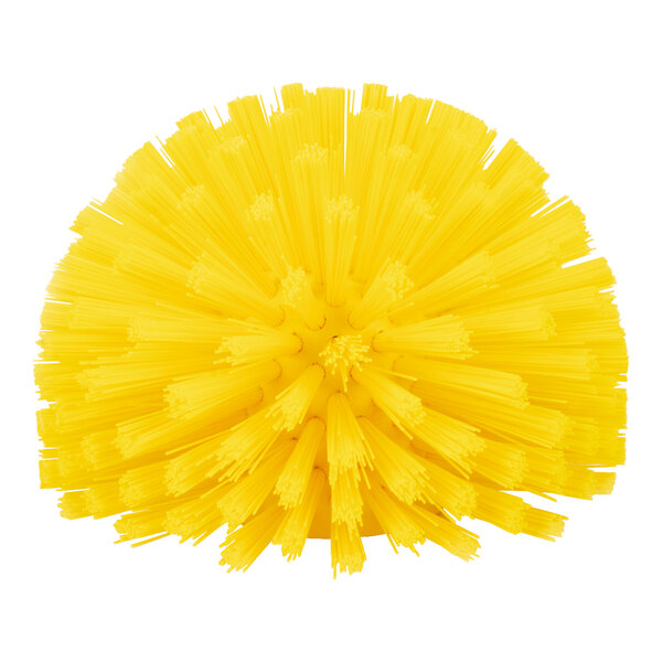 A yellow round Carlisle Sparta brush with many bristles.