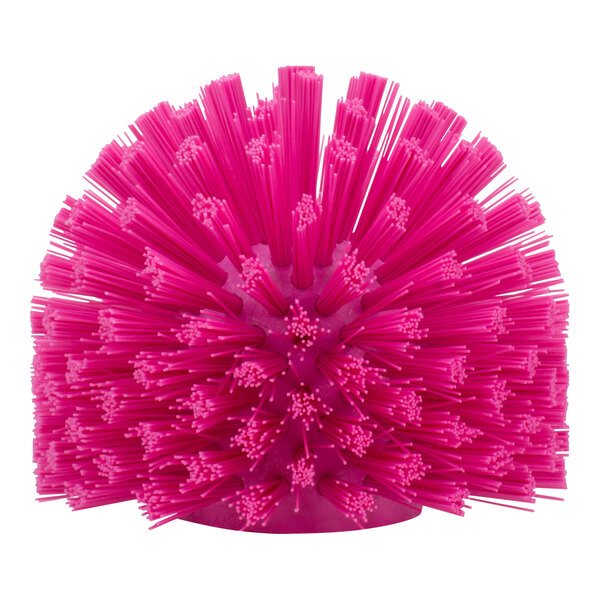 A pink round Carlisle Sparta brush with long bristles.