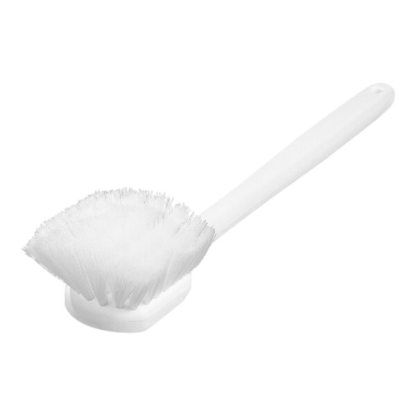 A close up of a Carlisle white pot scrub brush with a handle.