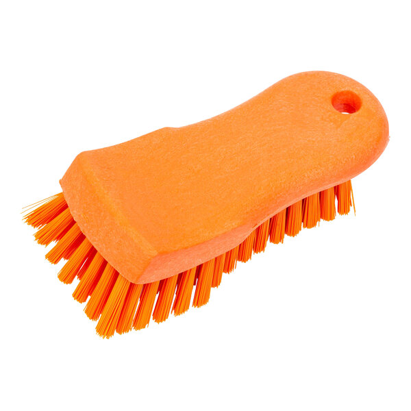 An orange Carlisle Sparta handheld scrub brush with orange bristles.