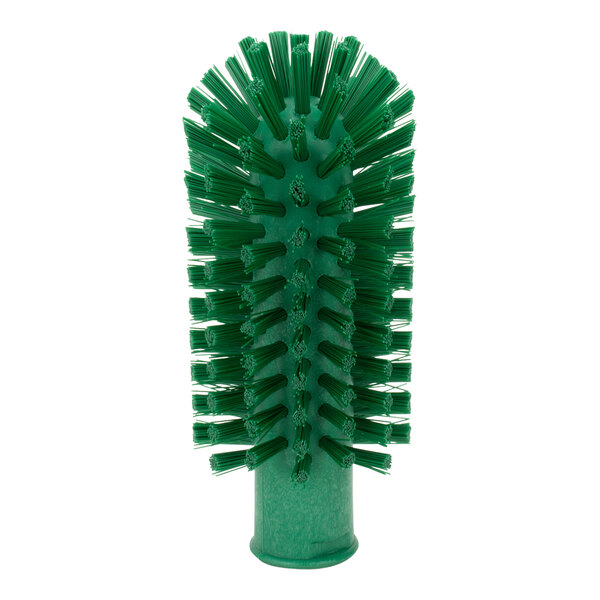 A Carlisle green brush with bristles designed for cleaning pipes and valves.
