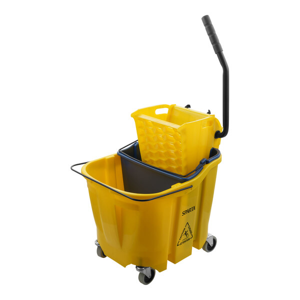 A yellow San Jamar mop bucket with a black handle and wheels.