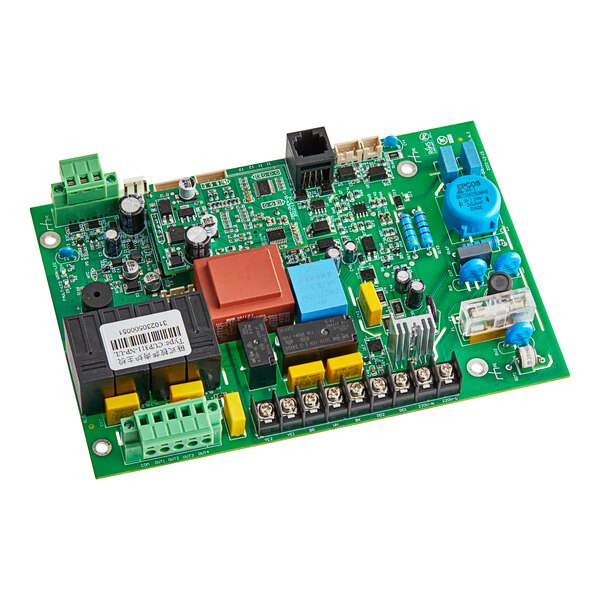 A green circuit board with many different colored components.