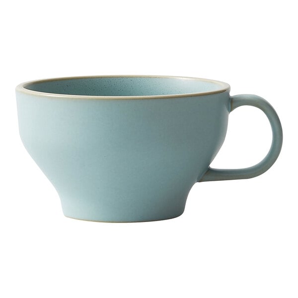 A close-up of a frosted blue Moira espresso cup with a handle.