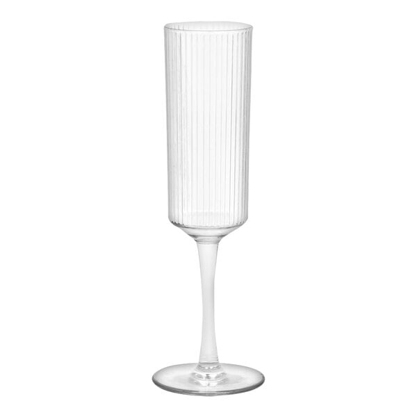 A clear plastic champagne flute with a clear stem.