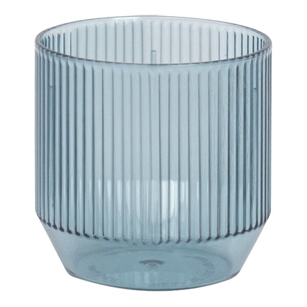A clear Front of the House Gatsby plastic rocks glass with a ribbed bottom and a striped peacock pattern in blue.