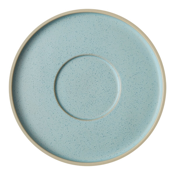 A frosted blue saucer with a white speckled rim.