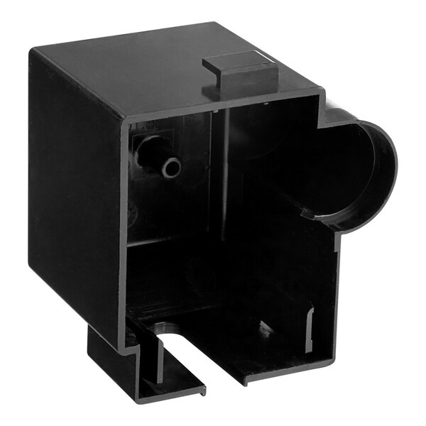 A black plastic compressor cover with a hole.