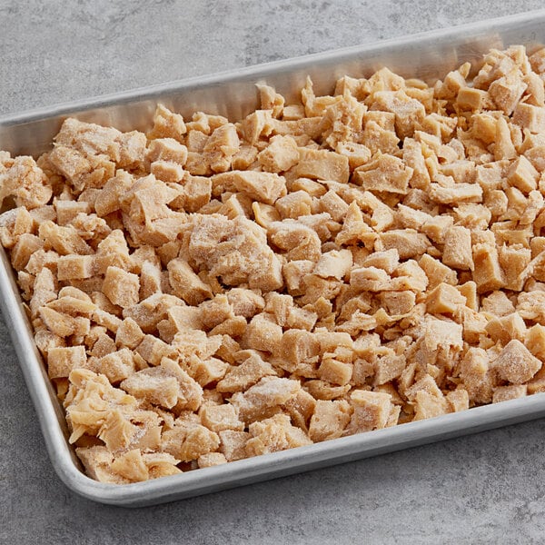 A baking pan filled with Daring Foods plant-based diced chicken.