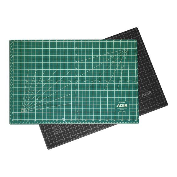An ADIRoffice green and black cutting mat with white lines on it.