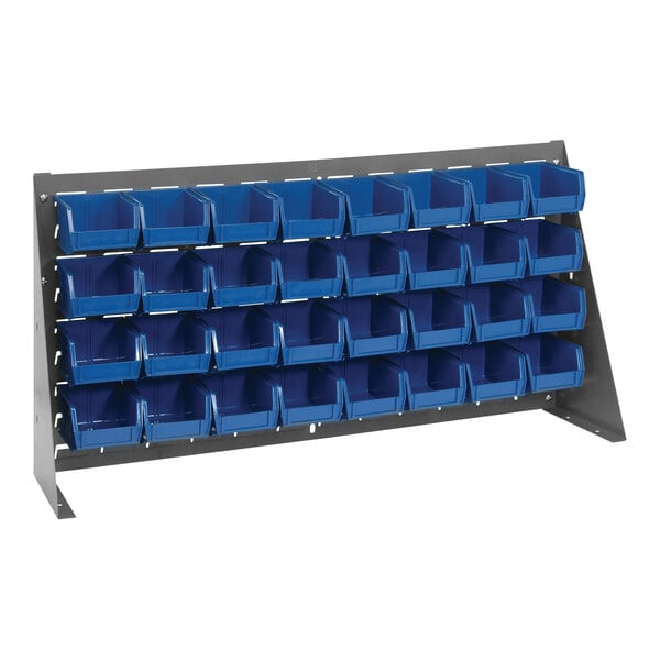 A Quantum gray steel bench rack with blue bins on it.