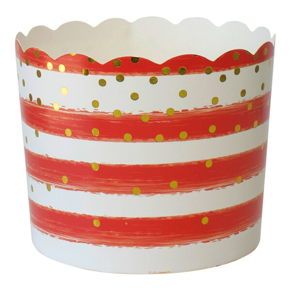 A red and white confetti baking cup in a red and white striped container.