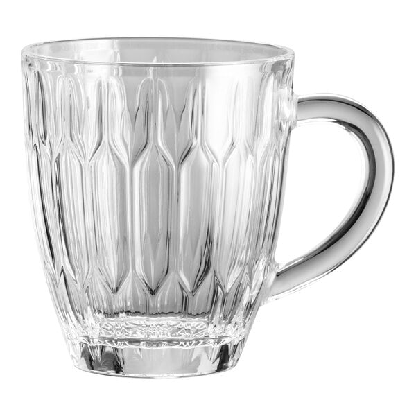 A WMF clear glass coffee mug with a handle.