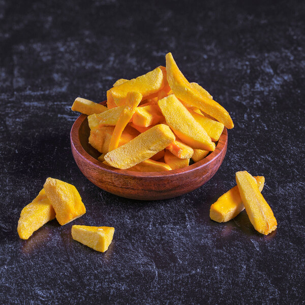 A pile of yellow freeze-dried mango slices.